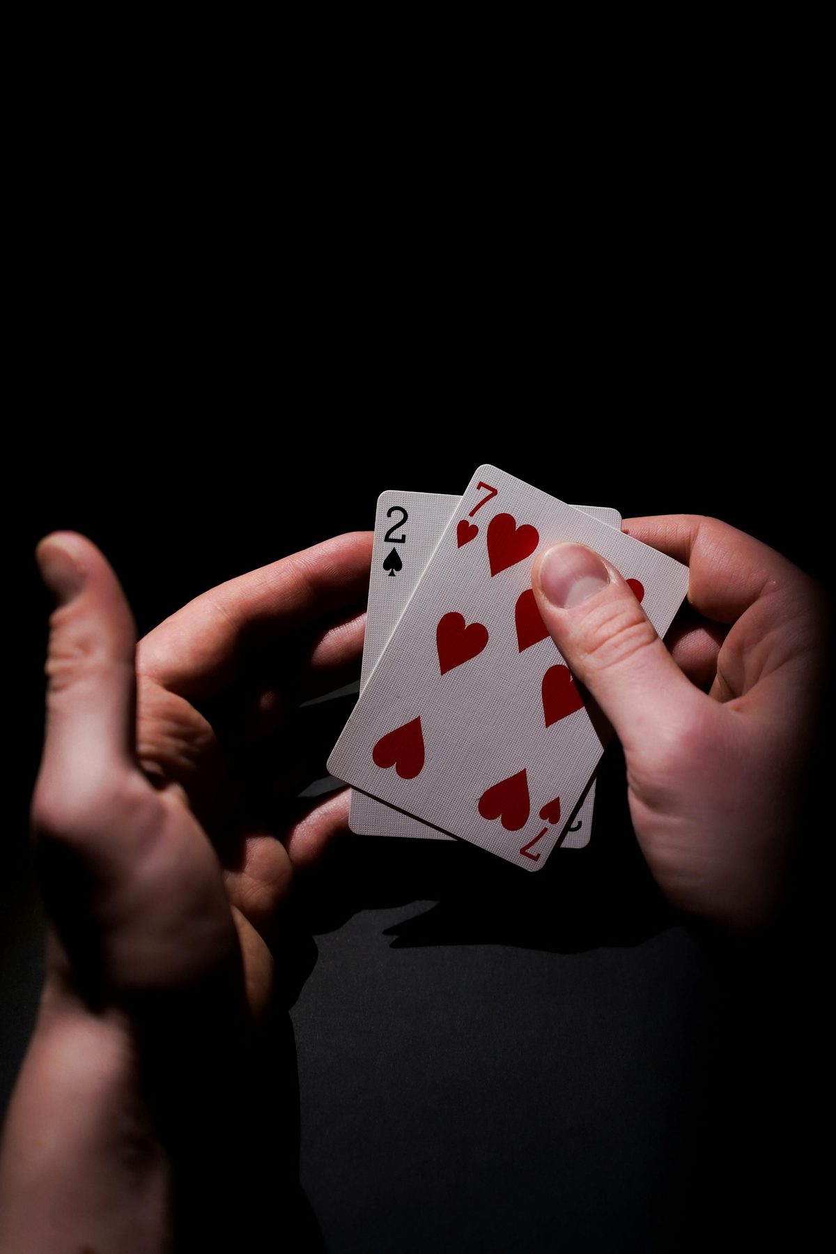 A player holding thirteen cards — most beginner losses come from ten fixable habits.